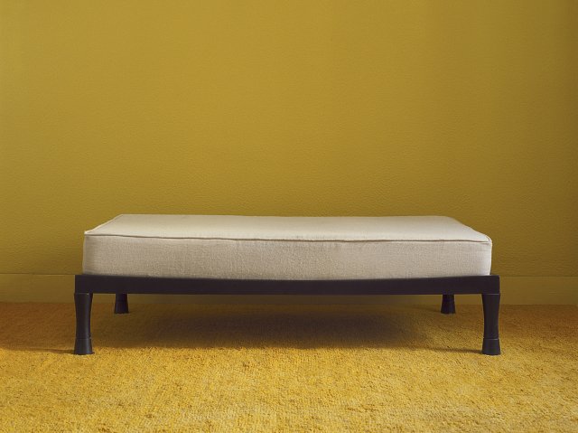African bench. Made in wood, loose matras.